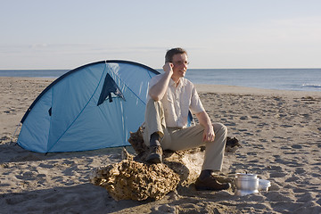 Image showing Man with tent on beach