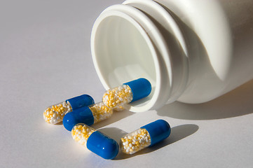 Image showing many capsules isolated on background