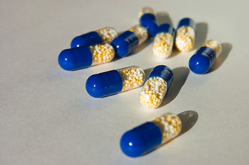 Image showing many capsules isolated on background