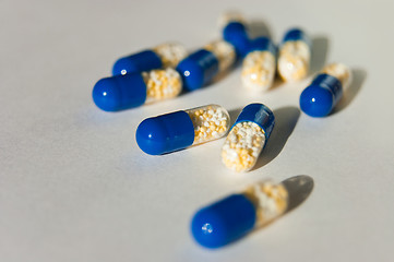 Image showing many capsules isolated on background