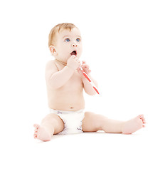 Image showing baby boy in diaper with toothbrush