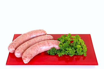 Image showing Sausages on red plate