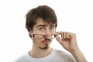 Image showing Young man take his glasses off