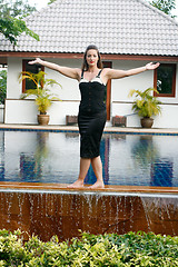 Image showing Woman by the pool.