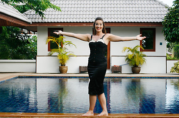 Image showing Woman by the pool.