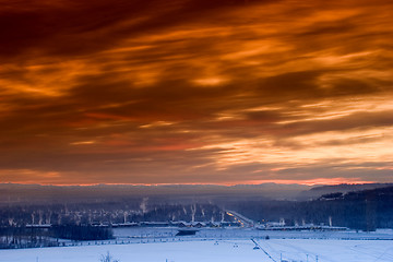 Image showing Sunset over frozen town