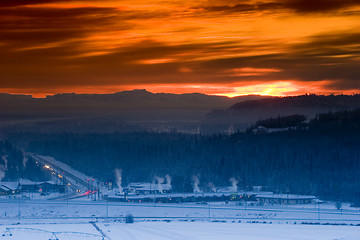 Image showing Sunset over frozen town