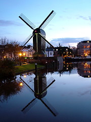 Image showing windmill reflected