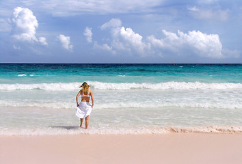 Image showing Girl splashes in surf