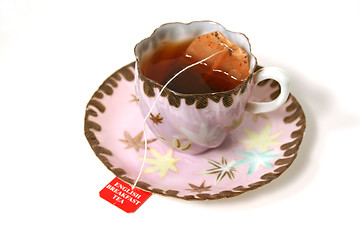 Image showing Antique cup with tea bag.