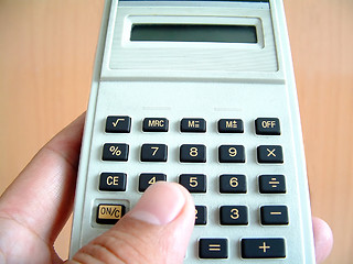 Image showing The use of calculator