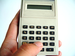 Image showing The use of calculator