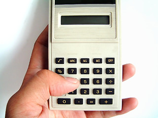 Image showing The use of calculator