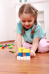 Image showing Adorable girl playing with blocks