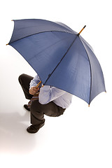 Image showing hiding bewind an umbrella