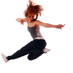 Image showing attractive teenage dancing over white background