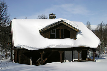 Image showing Wooden cabin, covered in a LOT of snow, Norway.