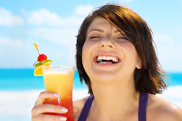 Image showing happy woman with colorful cocktail