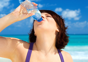 Image showing happy woman with bottle of water