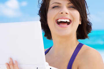 Image showing woman with laptop computer on the beach