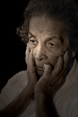 Image showing Sad old woman thinking