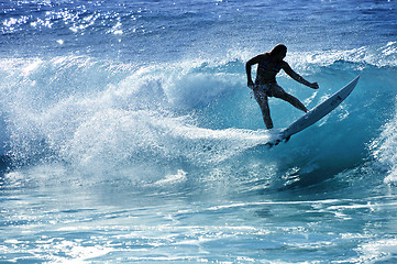 Image showing Hawaii, Kauai - Oct 21, 2008: Surfer girl Malia Rimavicus jumps over the lip of a wave at training