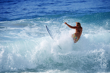 Image showing Hawaii, Kauai - Oct 21, 2008: Surfer girl Malia Rimavicus crashes into a wave at training