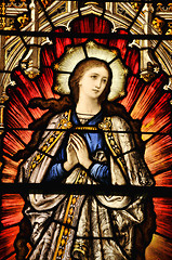 Image showing Stained Glass window of St Mary in contemplative prayer