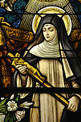 Image showing Stained Glass window of St Monica holding the cross of Jesus Chr