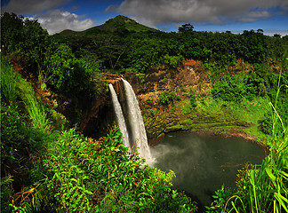 Image showing The Wailua falls tundering down into a quiet pool.  Kauai, Hawai