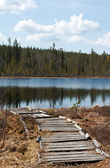 Image showing Old wooden pier to lake