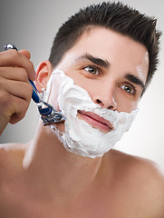 Image showing Man shaving