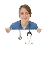 Image showing Nurse with stethoscope hanging over blank banner