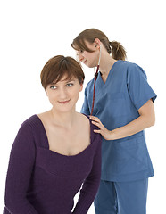 Image showing Nurse listening to patient's heart with stethoscope