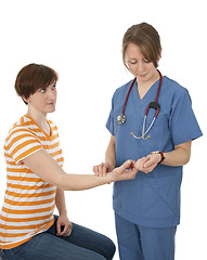 Image showing Nurse measuring patient's pulse