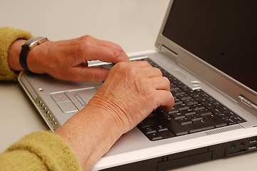 Image showing Typewriting on a lap-top