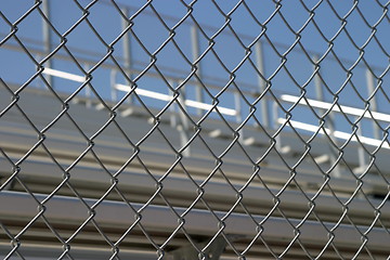 Image showing Bleachers Behind Fence