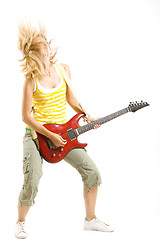 Image showing woman guitarist breaking her guitar