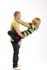 Image showing young man holding his girlfriend on his back