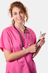 Image showing Young nurse with chart