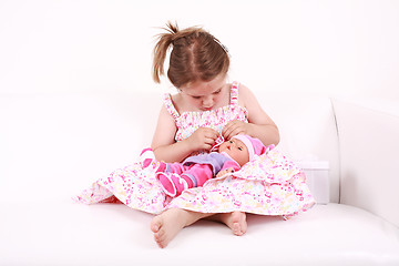 Image showing Playing with doll