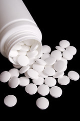 Image showing bottle with white pills