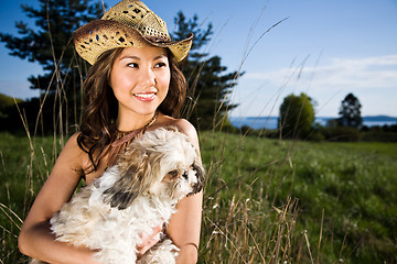 Image showing Summer girl with her dog