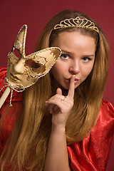 Image showing beautiful girl with carnival mask shows gesture of silence