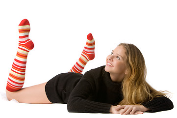 Image showing beautiful smiling girl lies on the floor