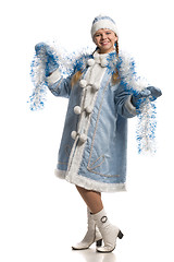 Image showing Happy girl in snow maiden coat with tinsel