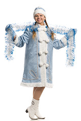 Image showing Smiling snow maiden with tinsel