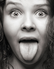 Image showing funny woman with green tongue