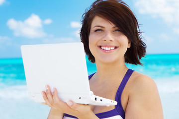 Image showing woman with laptop computer on the beach