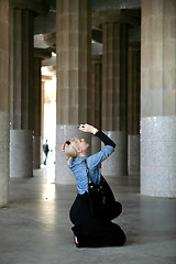 Image showing Young woman take a photo in Hypostyle hall  at Guell Park